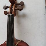 violin and decorative archer in antique varnished wood