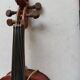 violin and decorative archer in antique varnished wood