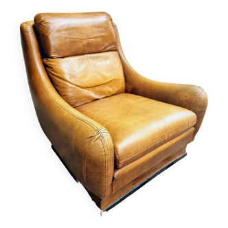 Old leather armchair French cognac color