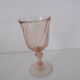Old bottle in pink glass and 2 wine glasses