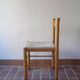 4 solid pine chairs, straw seats, shaped backrest.