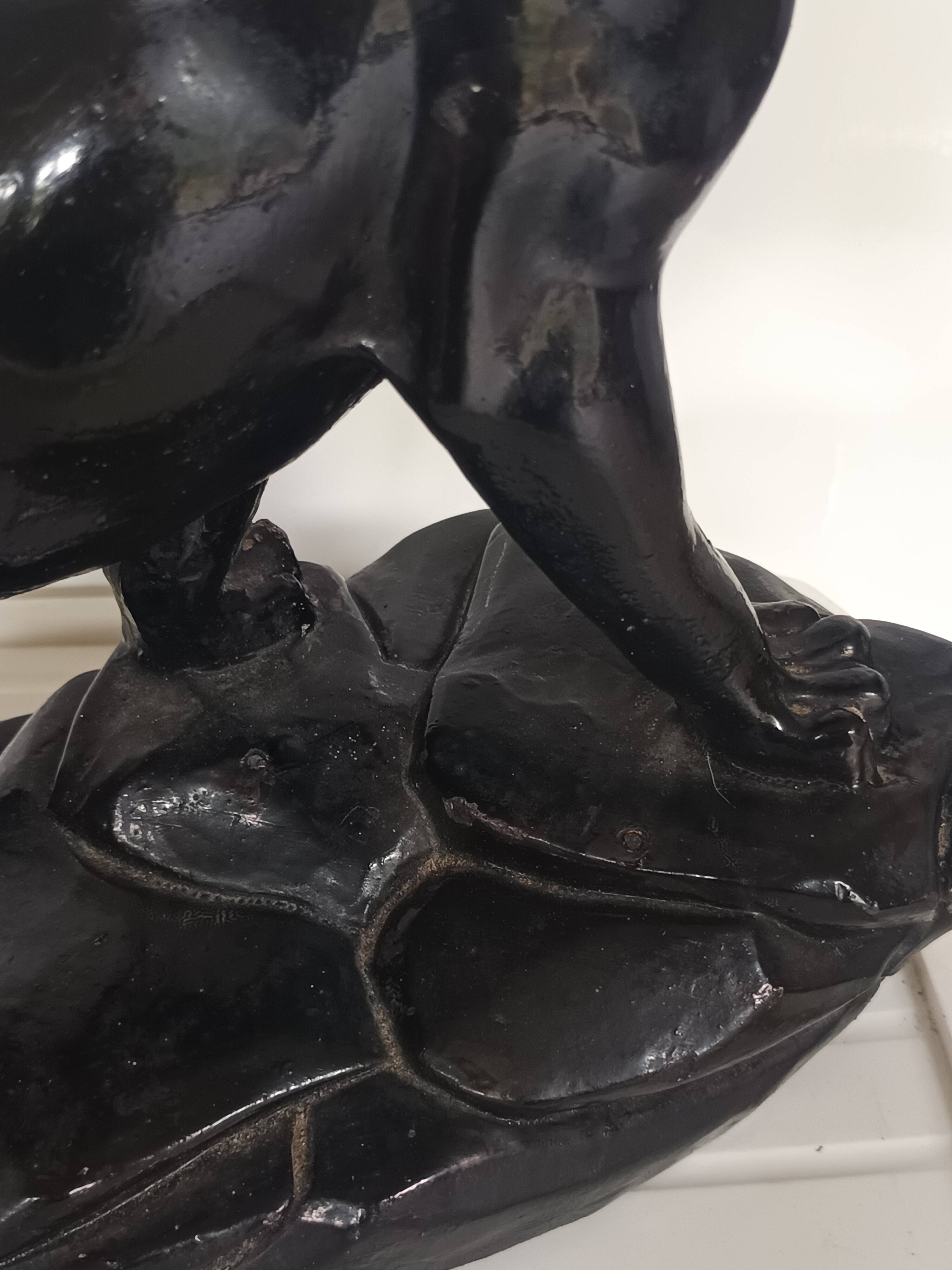 Large animal sculpture representing a roaring panther, signed BE.