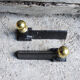 Old cast iron and brass andirons in neoclassical style