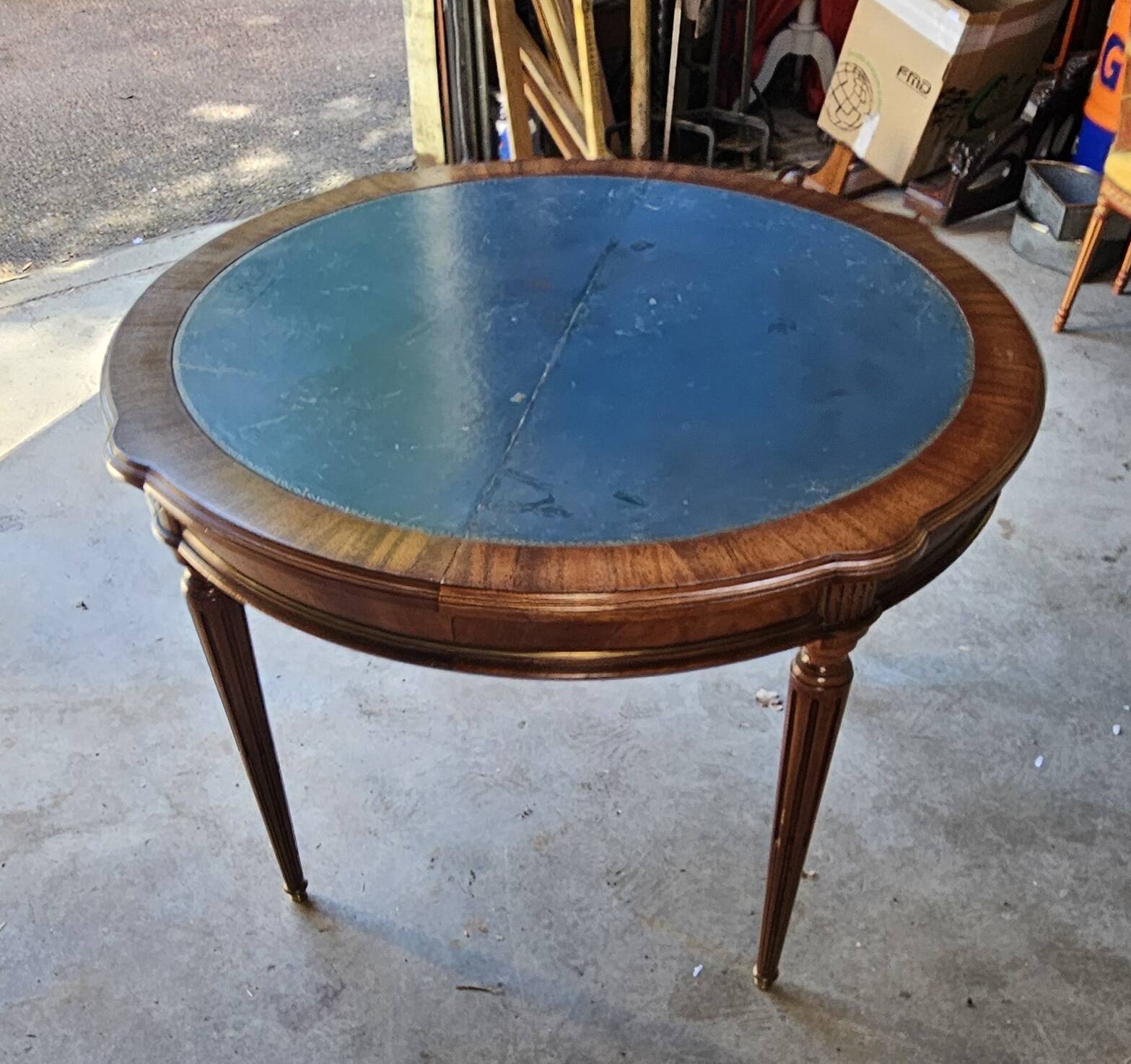 Elegant game table or circular extending side table in Louis XVI style.