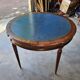 Elegant game table or circular extending side table in Louis XVI style.