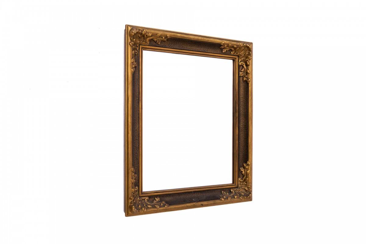 Mirror in a decorative gold frame, 63.5 x 54 cm
