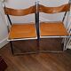 2 Chromed metal and leather folding chairs. 70s. Fontoni & Geraci