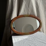 Small oval Art Deco mirror in brown and gold 33x54.