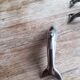 Set of three silver metal dolphin place markers