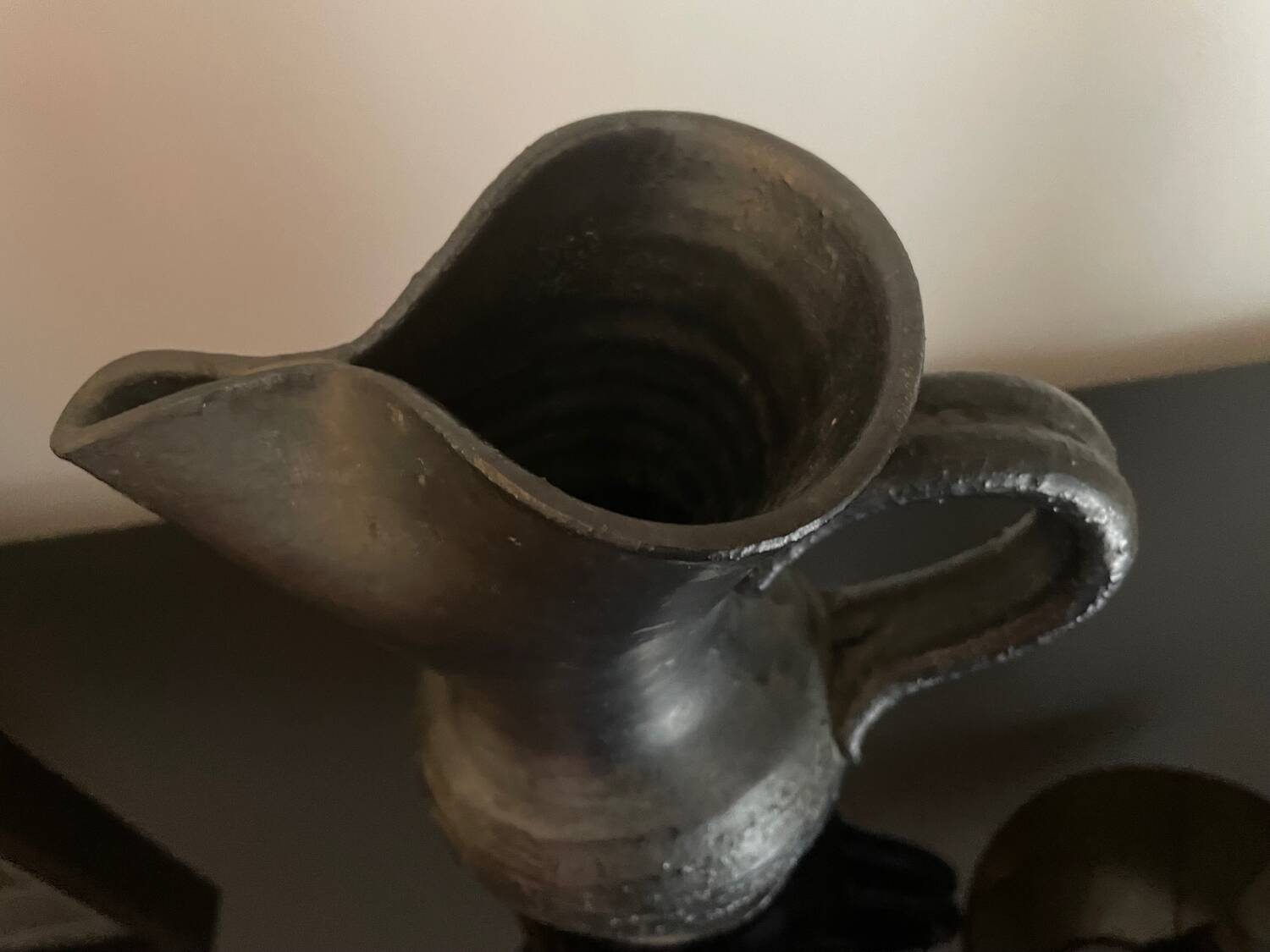 Black ceramic pitcher by Jean Marais