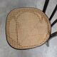Chaise de salle à manger vintage style Thonet en bois noir et assise en cannage 1970
