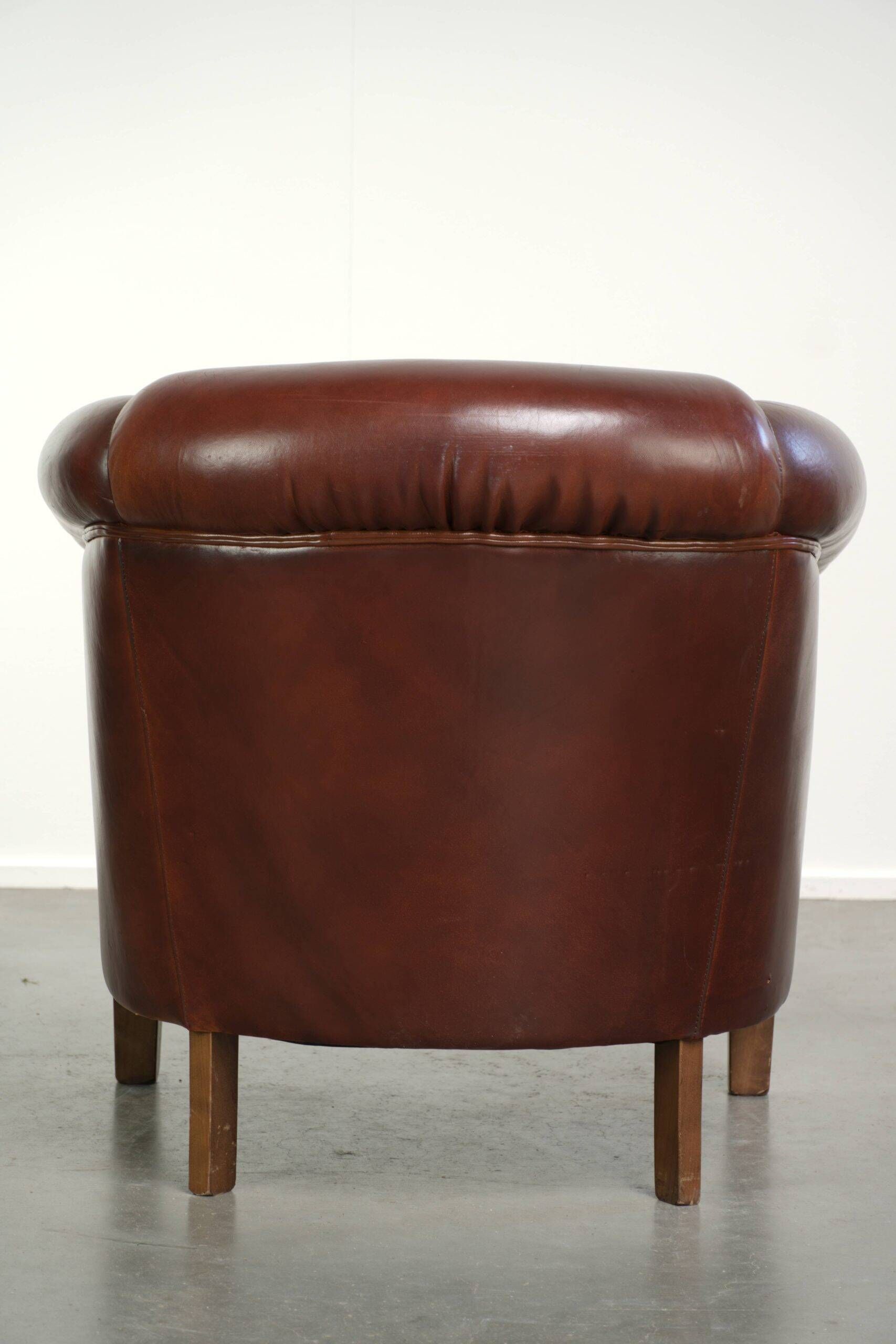 Sheepskin club armchair in English style with brown colour scheme