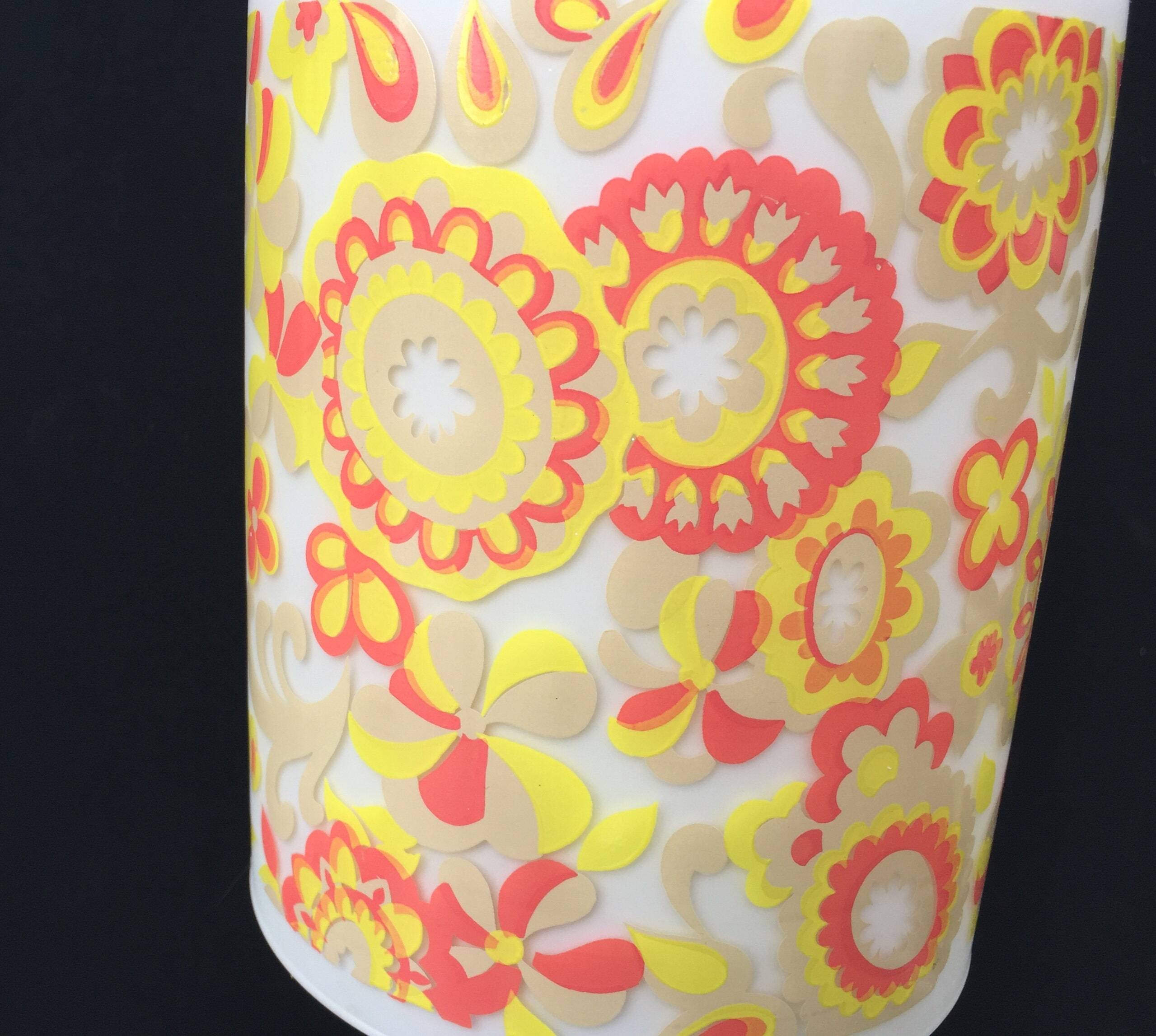 White and orange tube chandelier with seventies pop flowers