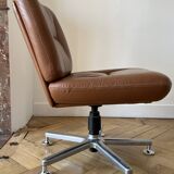 Pair of cognac-colored swivel armchairs