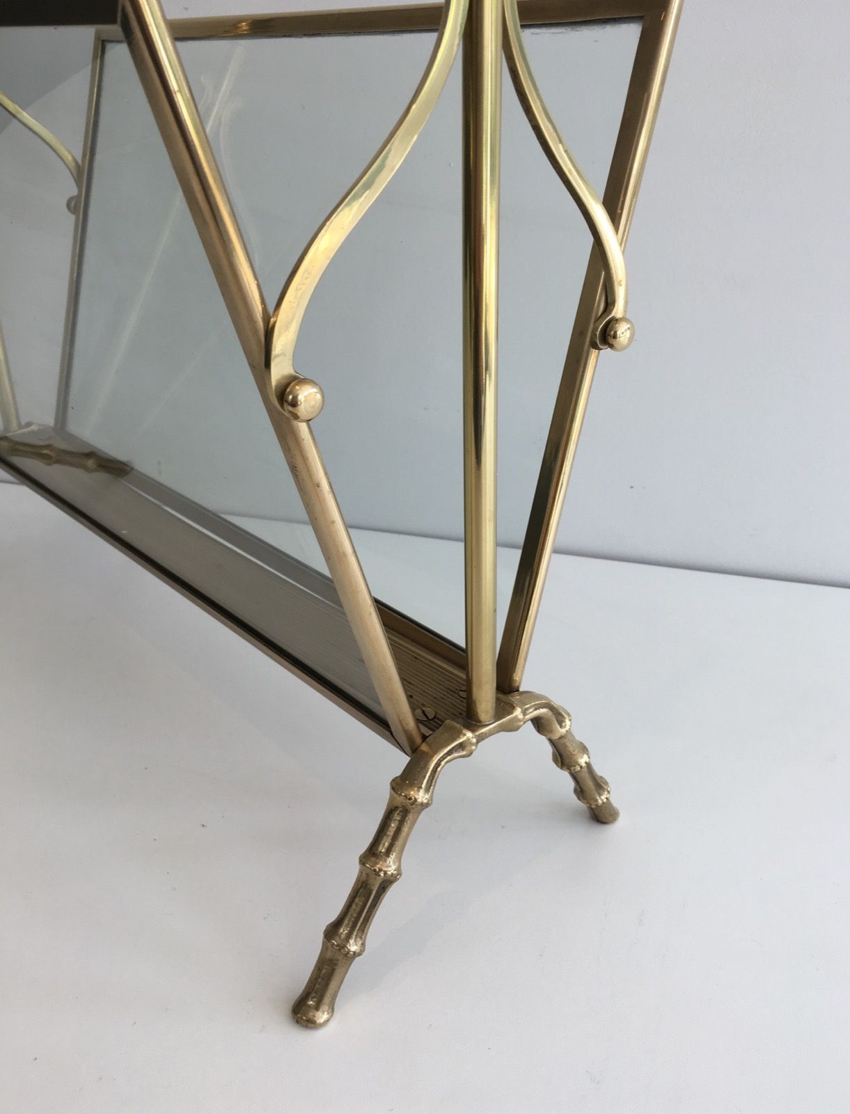 Bamboo-style brass magazine rack from the Baguès house.