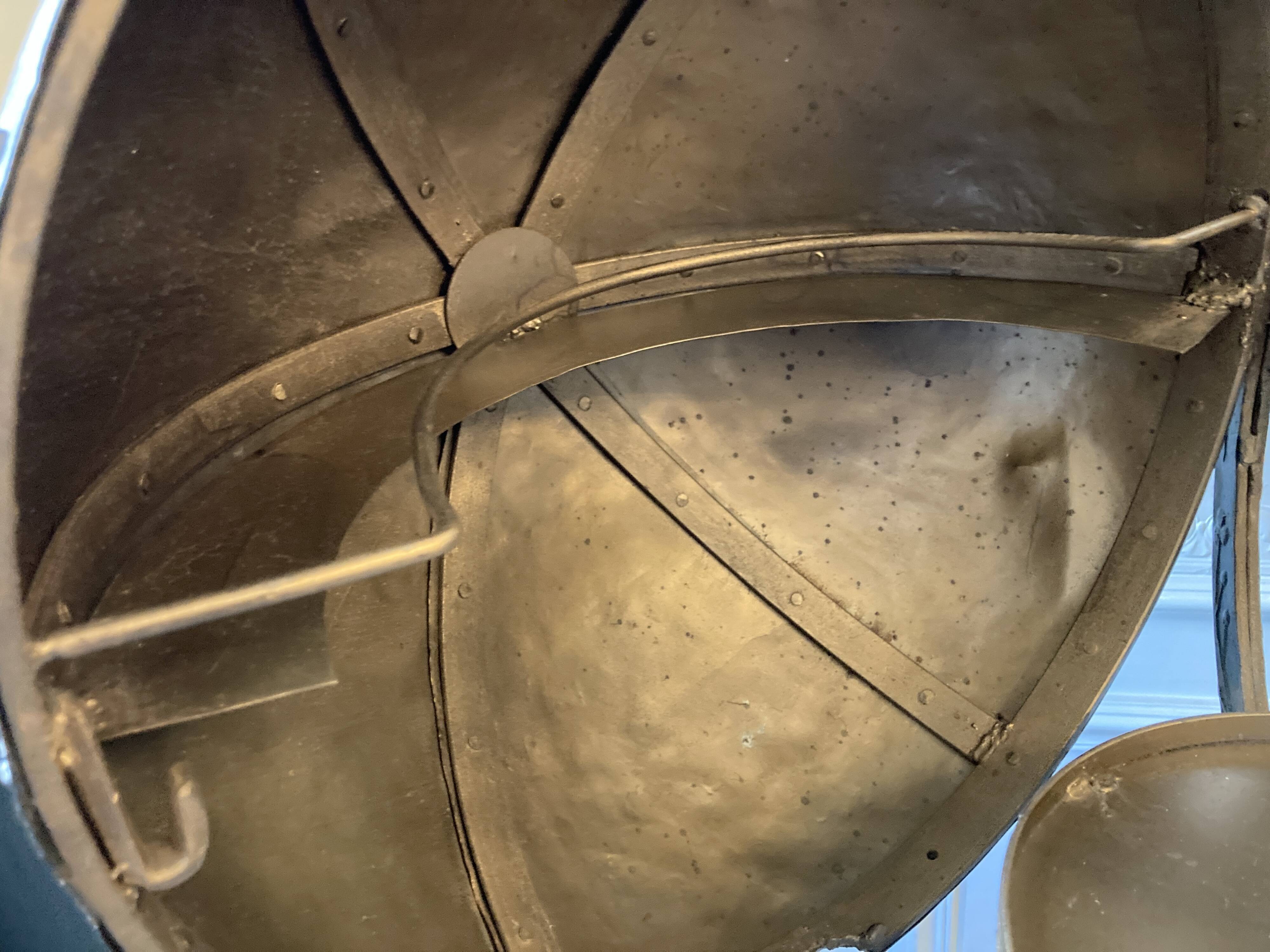 Atypical industrial furniture riveted sphere