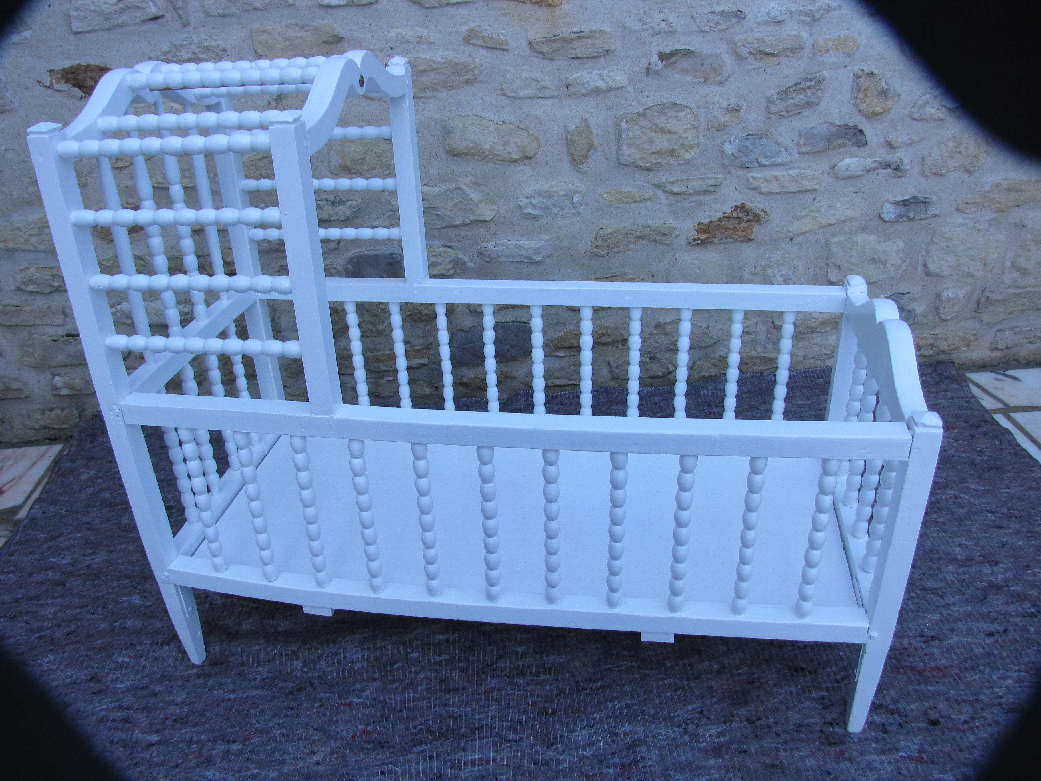White turned wooden cradle