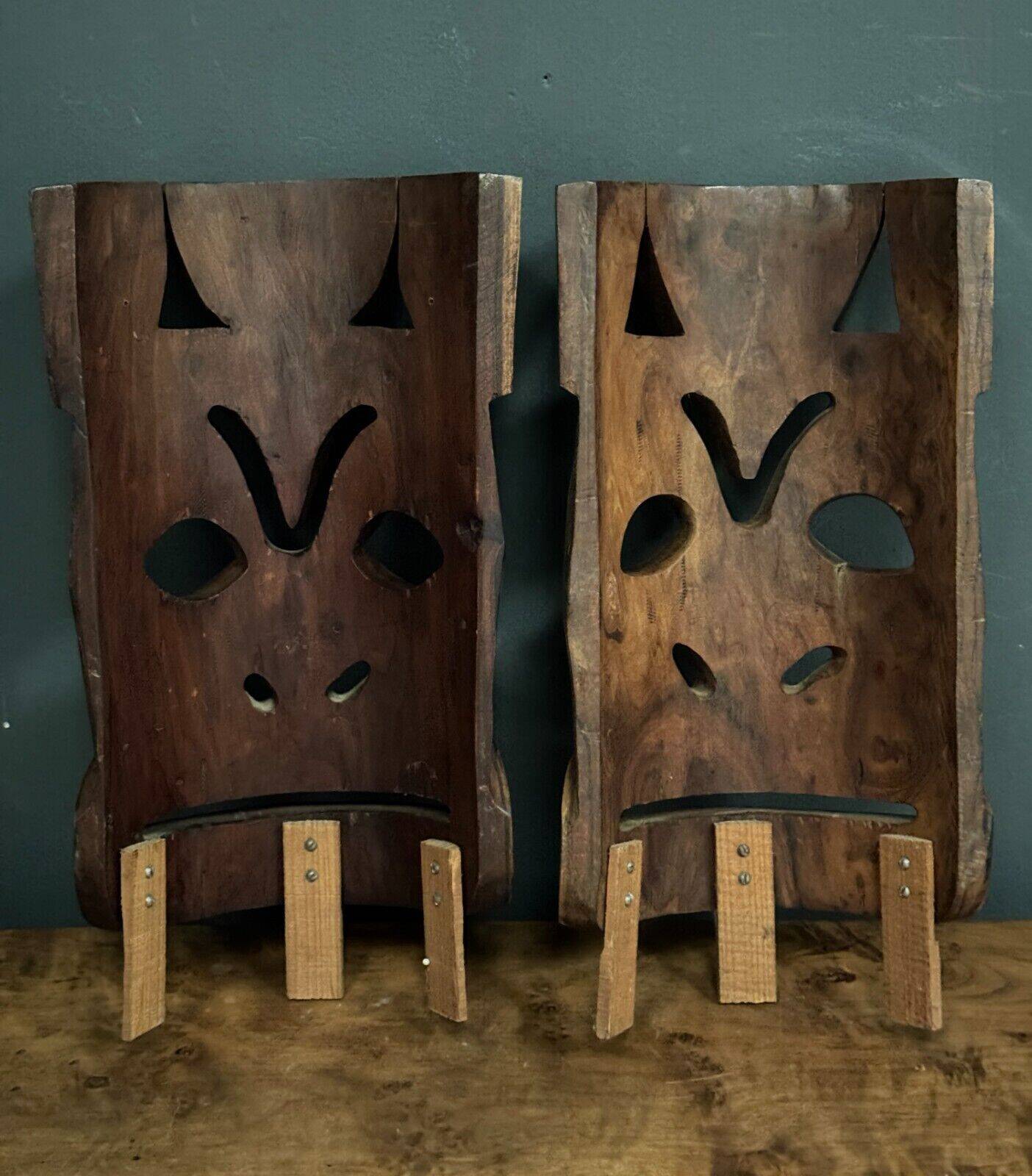 Pair of mid-20th century Africanist statue masks in carved wood