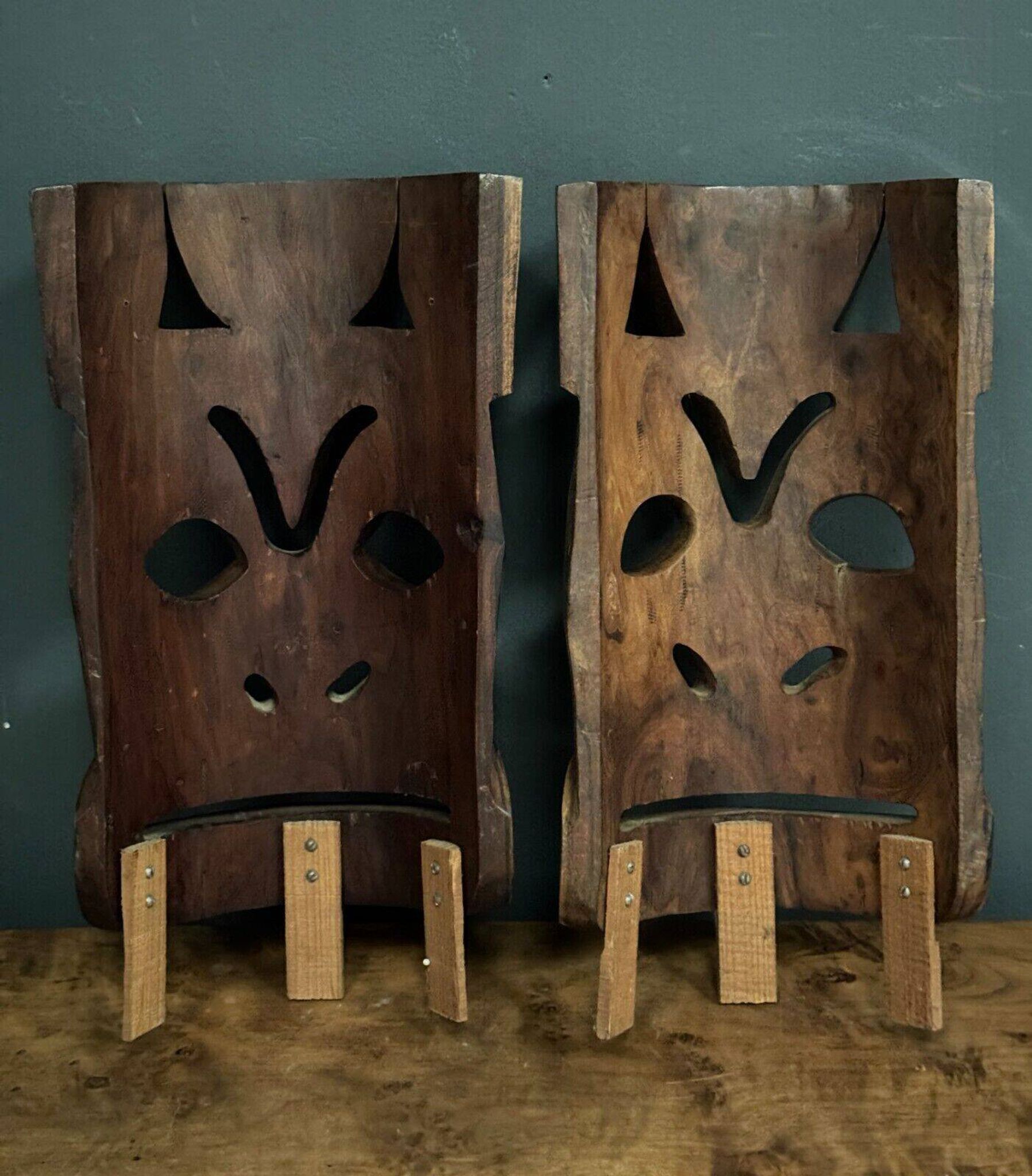 Pair of mid-20th century Africanist statue masks in carved wood