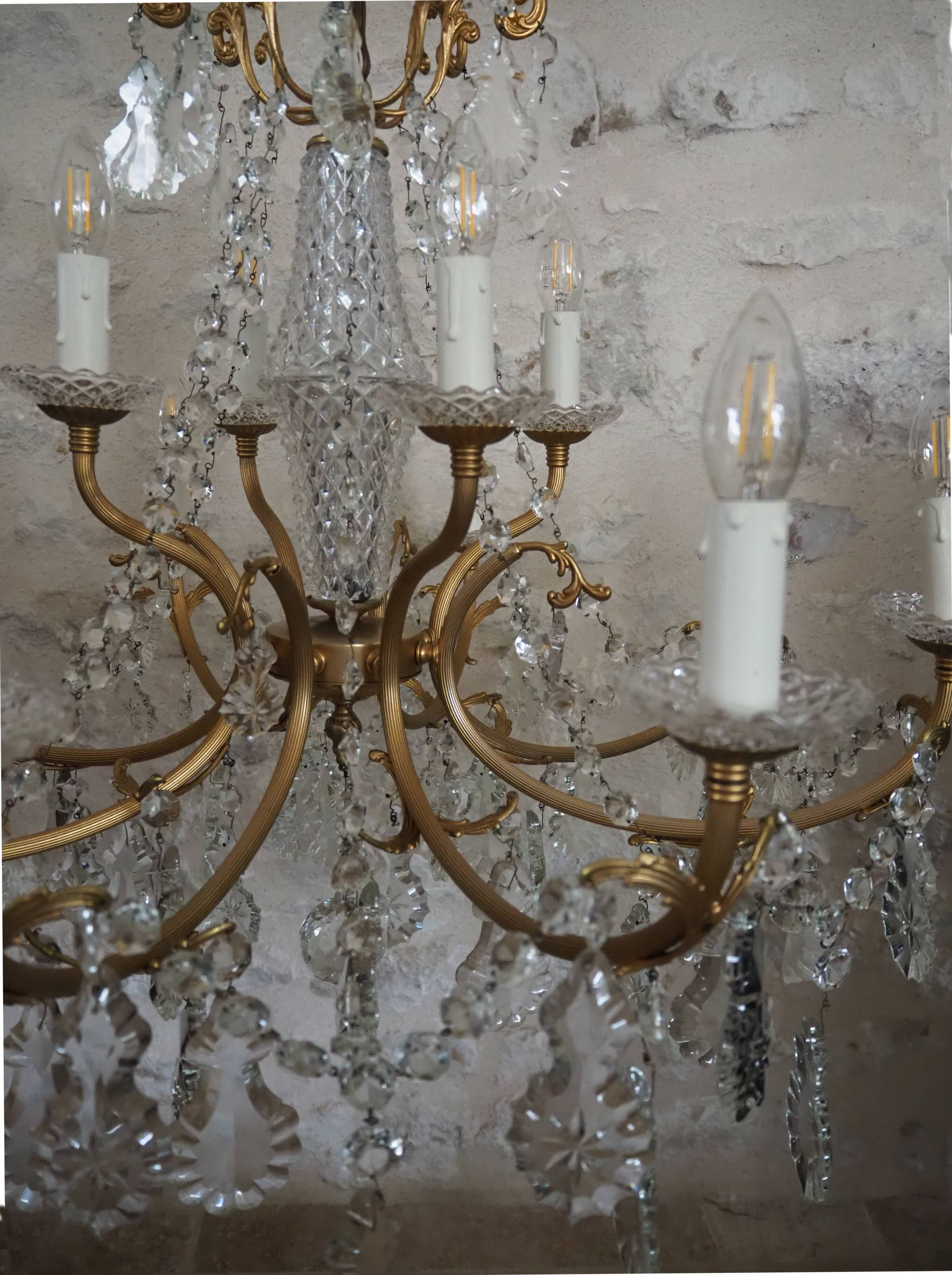 Chandelier 12 lamps with grapevines in crystal, bronze and regulated