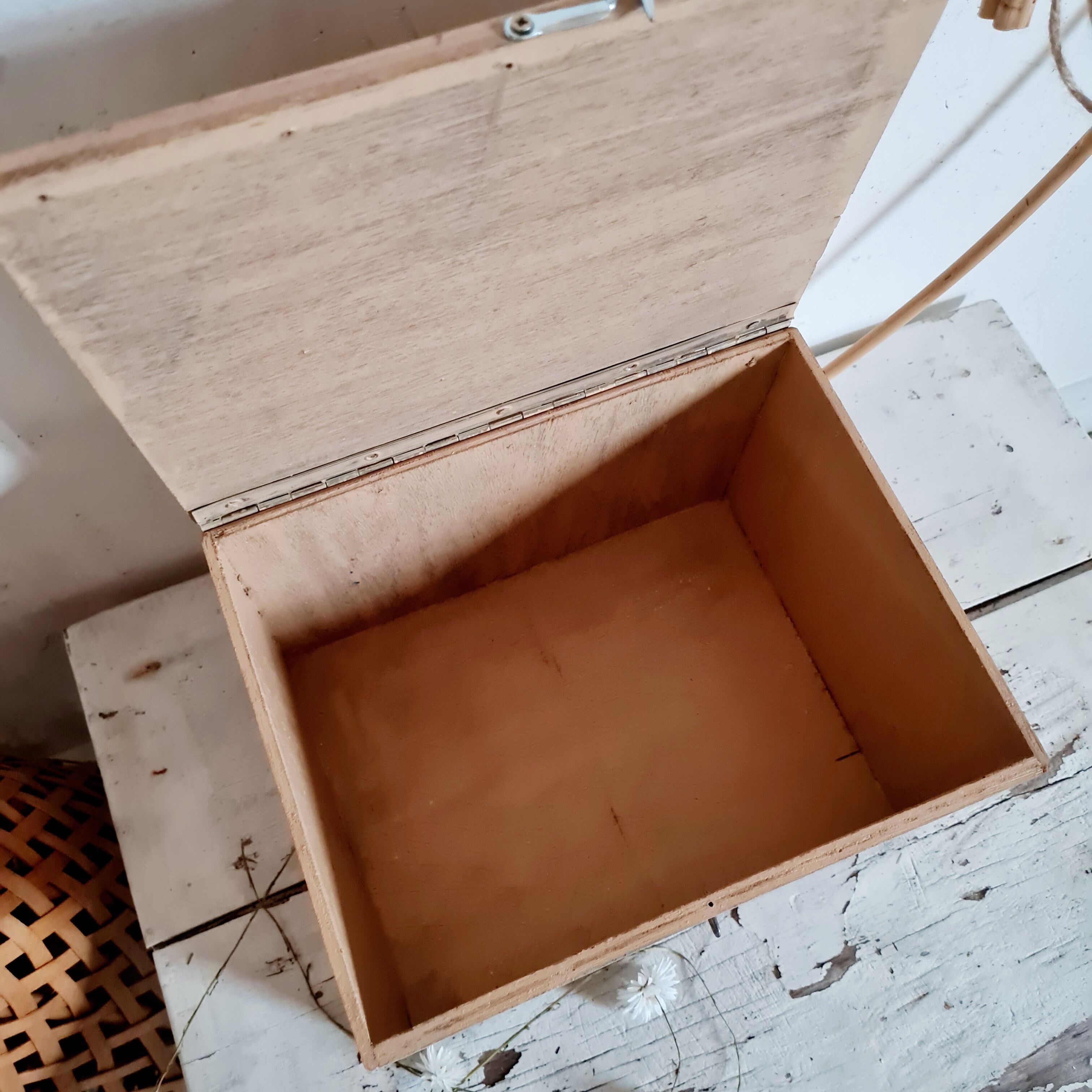 Small trunk in old wooden chest