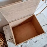 Small trunk in old wooden chest