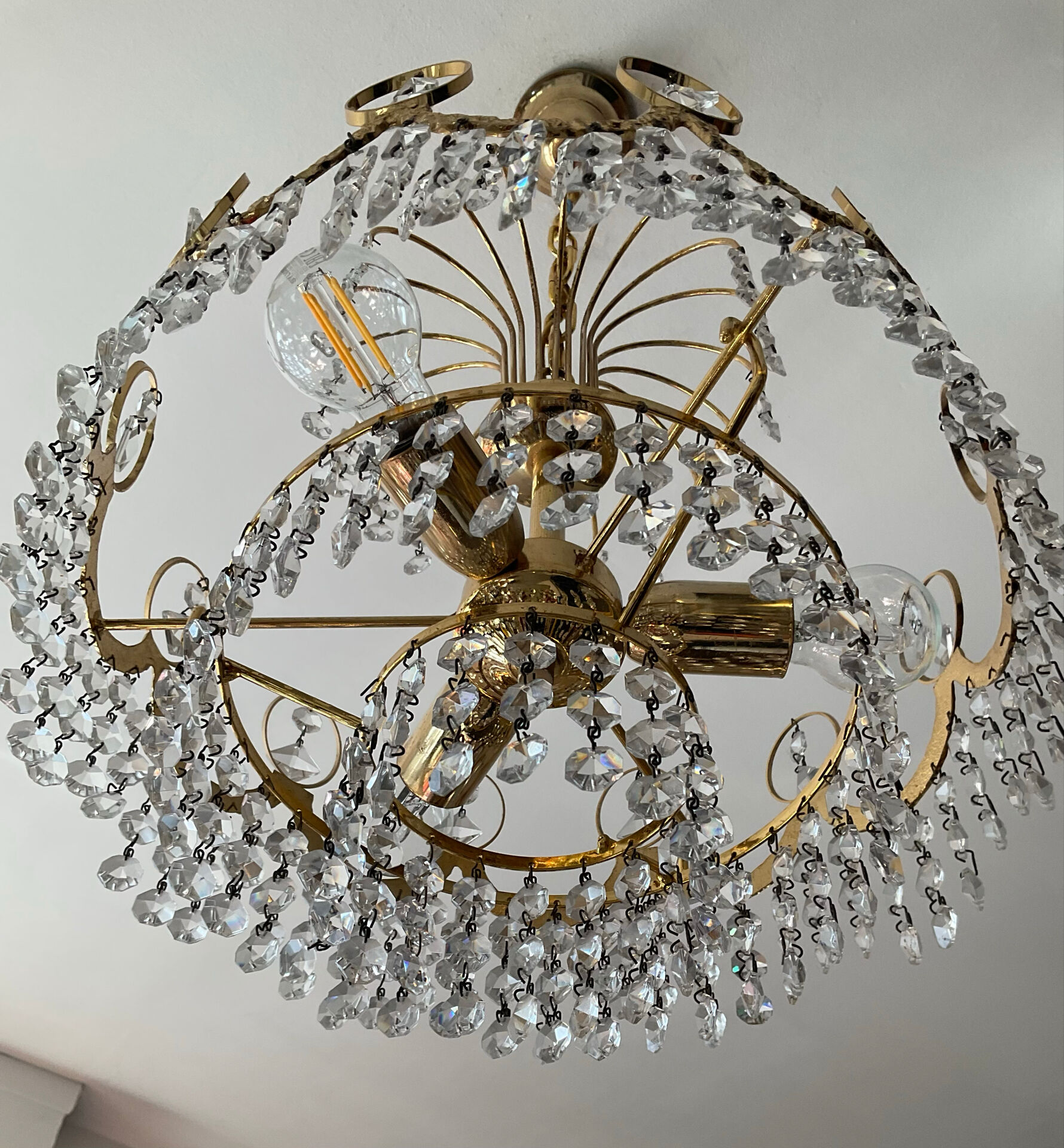 Brass chandelier with crystal pendants from the 1970s.