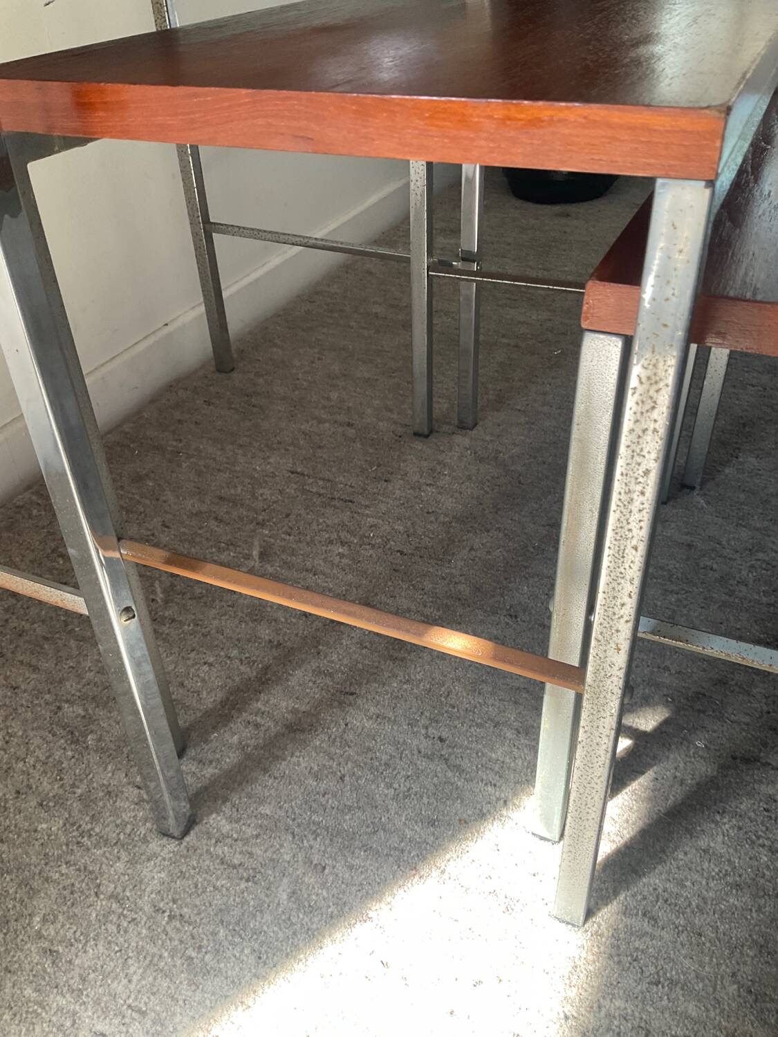 Trio of teak and chrome metal nesting tables from the 60s-70s