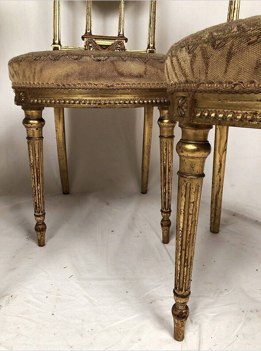 Series of three Louis XVI style chairs in gilded wood, circa 1900