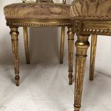 Series of three Louis XVI style chairs in gilded wood, circa 1900