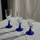 Set of 6 blue-footed champagne flutes; 3 pairs of designs.