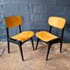 2 vintage chairs in black lacquered wood and yellow/mustard fabric, 1960