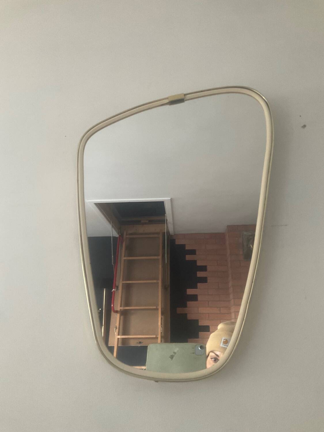 Asymmetrical free-form mirror from the 70s