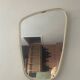 Asymmetrical free-form mirror from the 70s