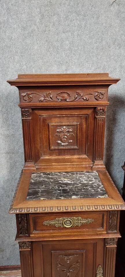 Pair of Renaissance style bedside tables in carved walnut, 19th century