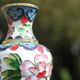 Two small vintage cloisonné enamel vases with Asian floral decoration.