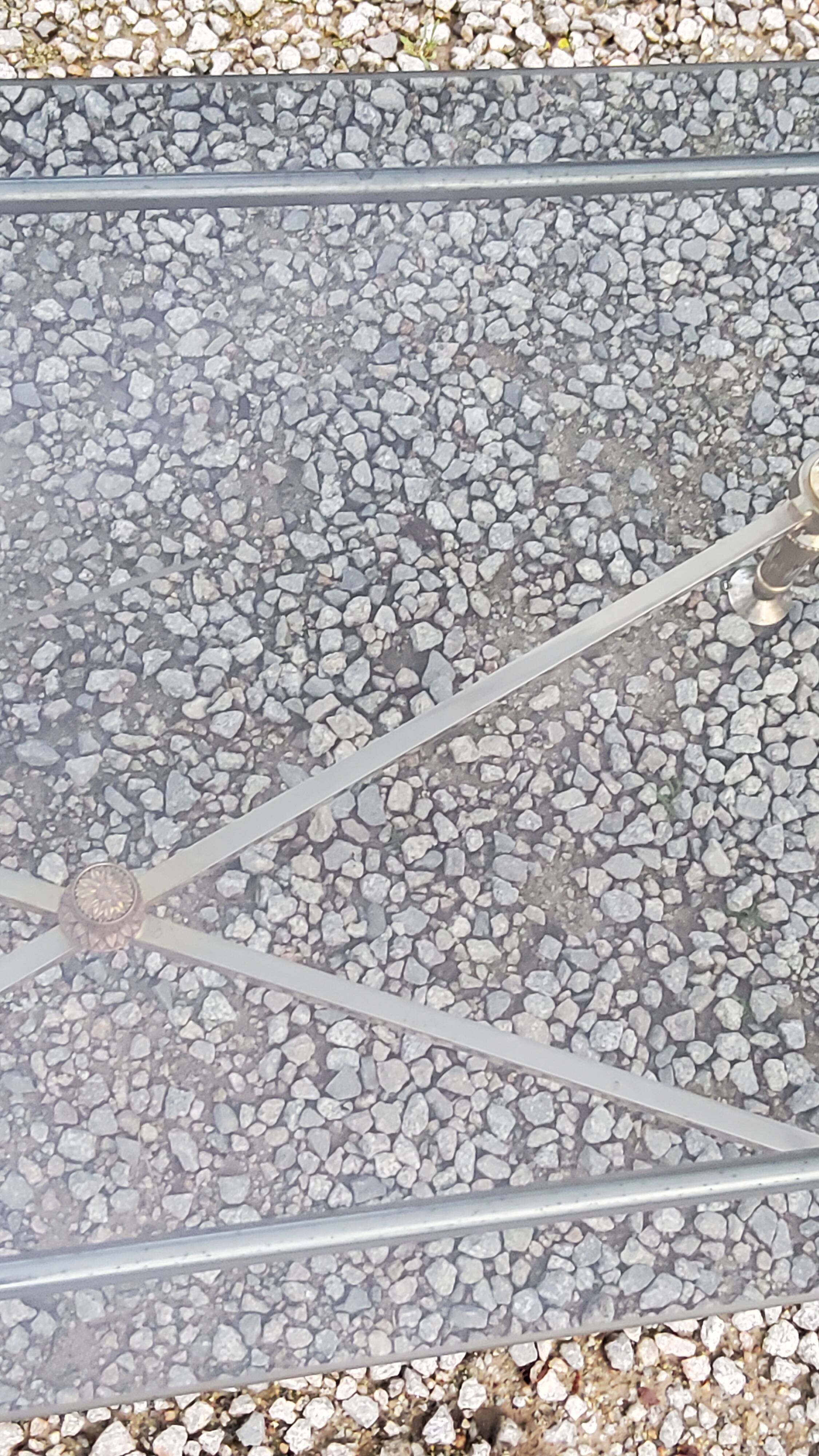 Coffee table of the 70s in neo-classical style gilded metal base and chrome smoked glass top