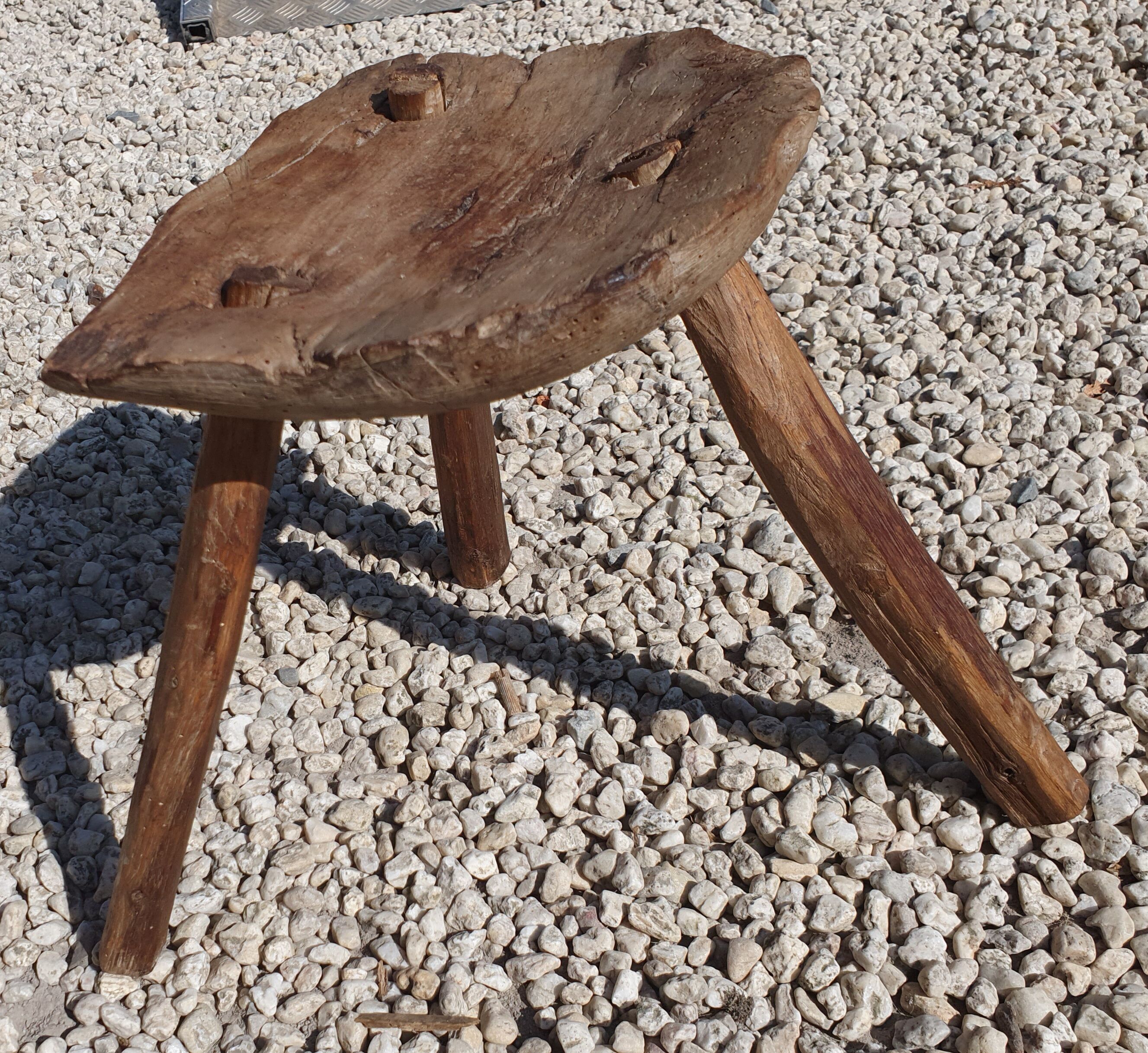 Ancient tripod milking stool