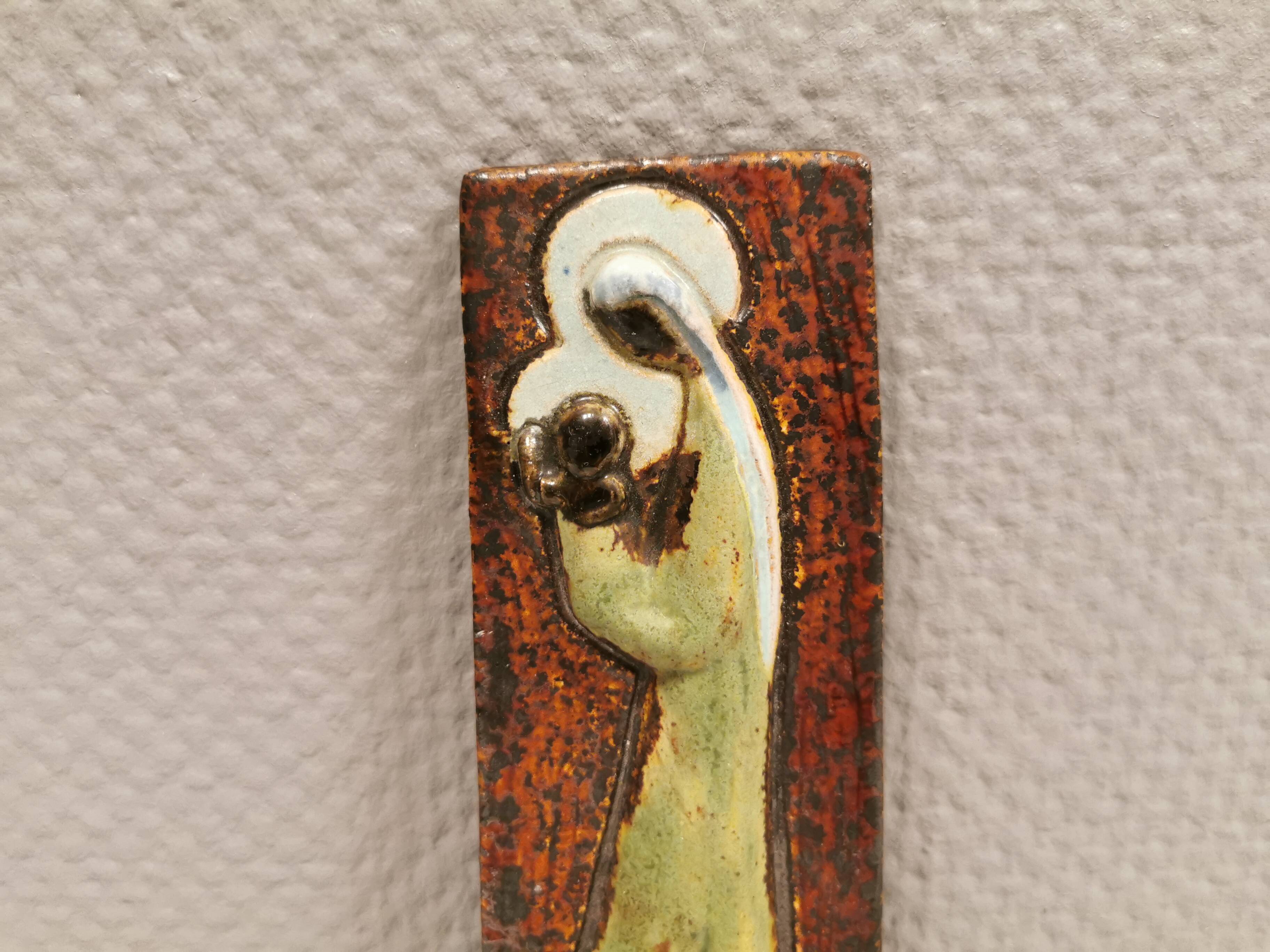 Slim relief with a motif of Madonna and child.