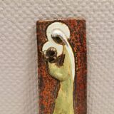 Slim relief with a motif of Madonna and child.