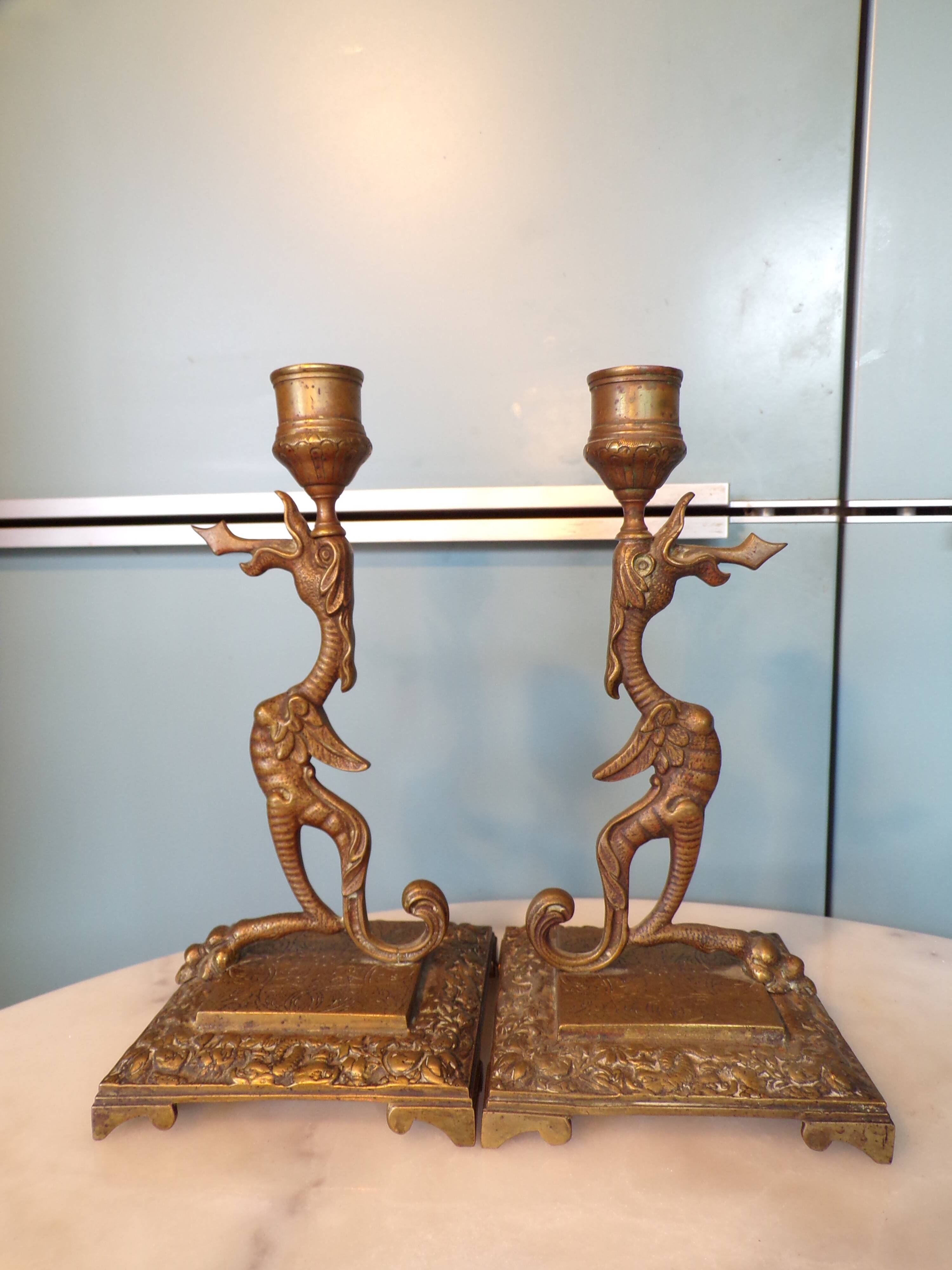 Pair of bronze chimera candlesticks