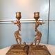 Pair of bronze chimera candlesticks
