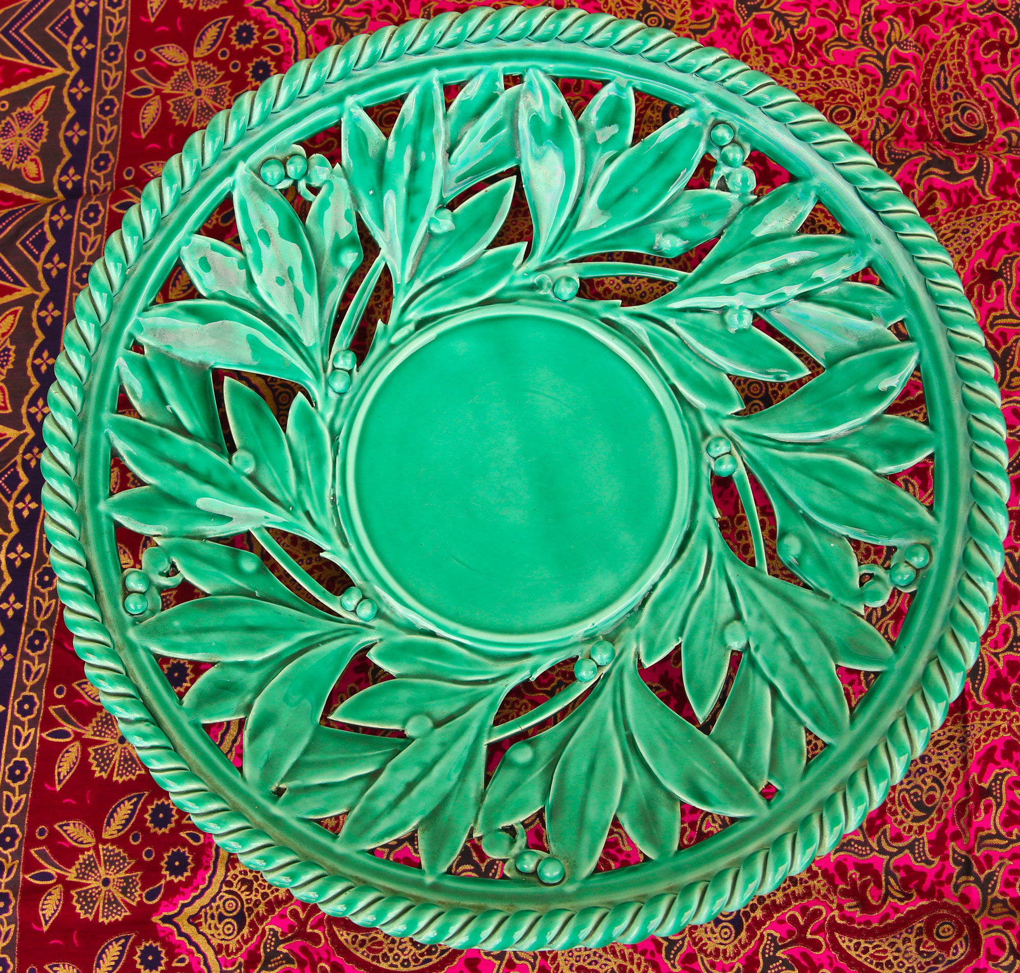 Openwork XL dish in green slurry like olive branches