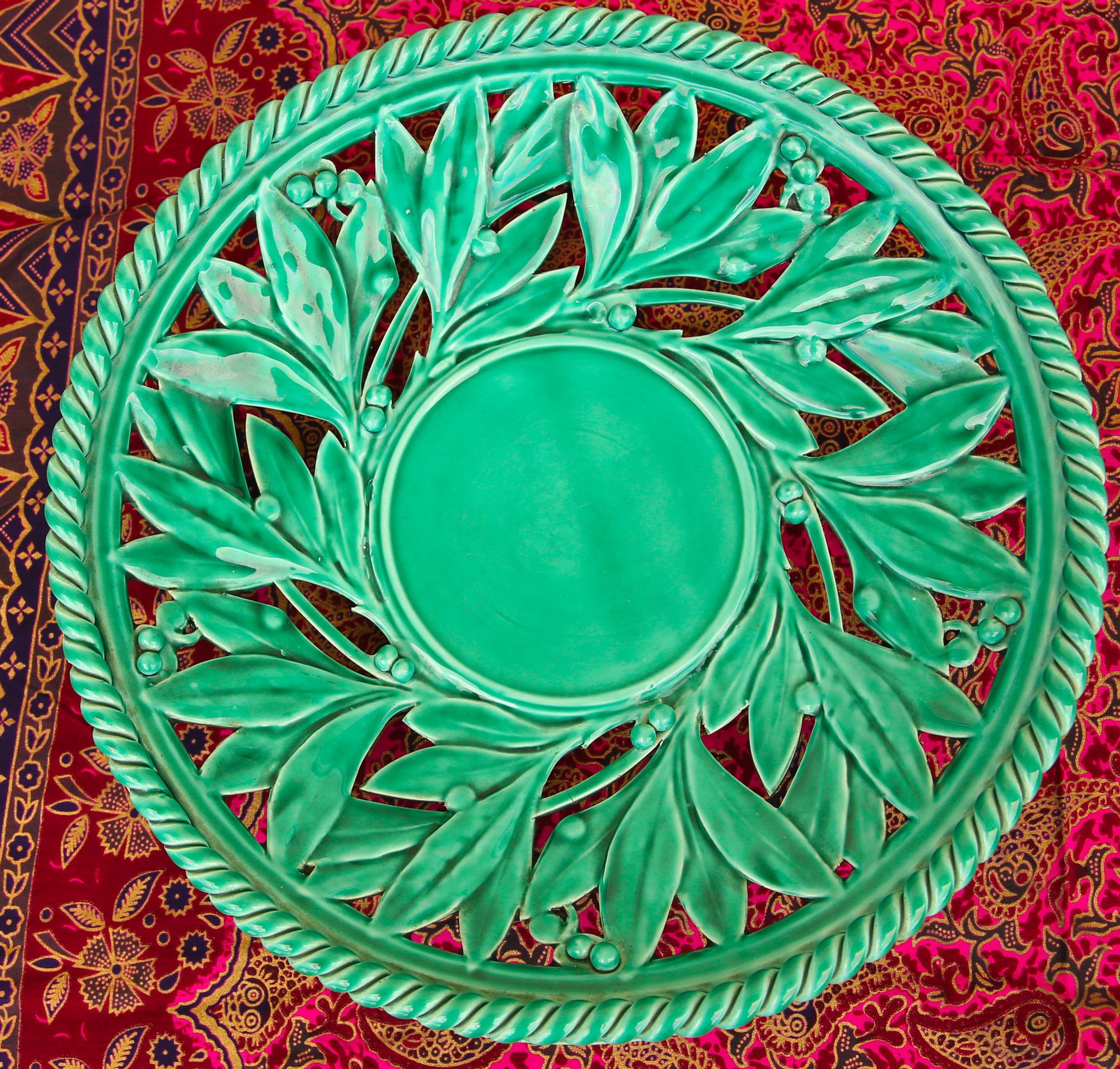 Openwork XL dish in green slurry like olive branches