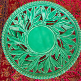 Openwork XL dish in green slurry like olive branches