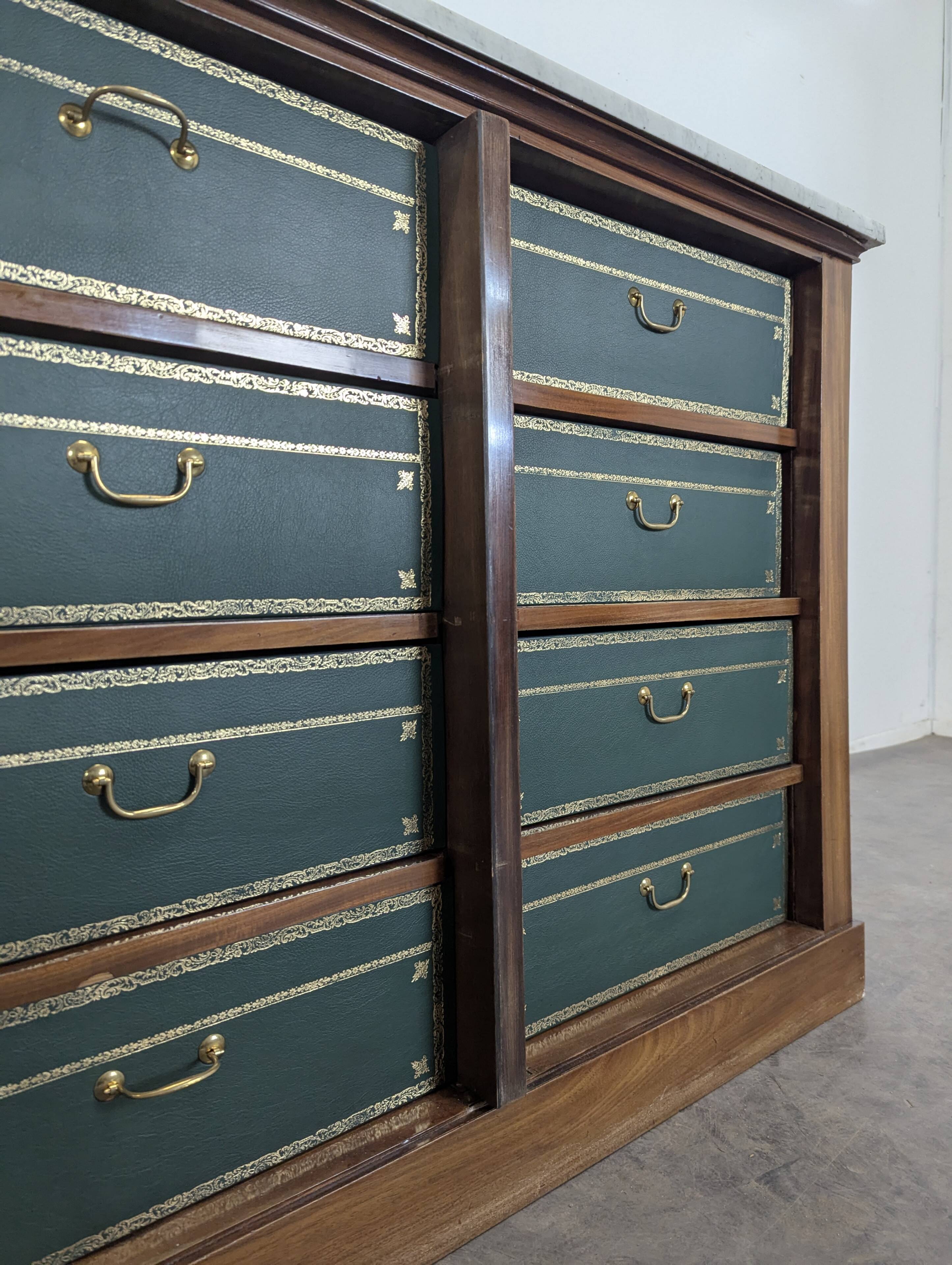 Notary cabinet topped with a Carrara marble.