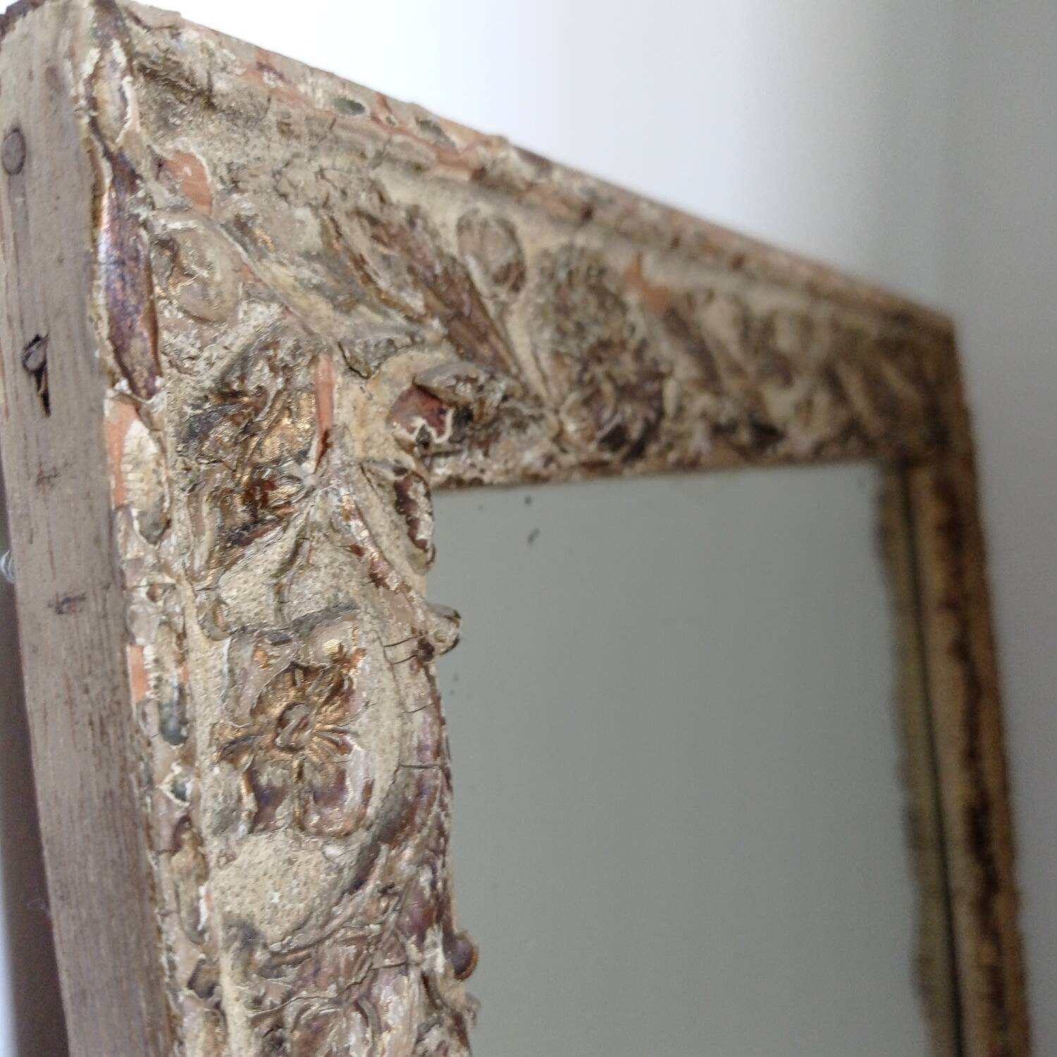 Wood and patinated stucco mirror