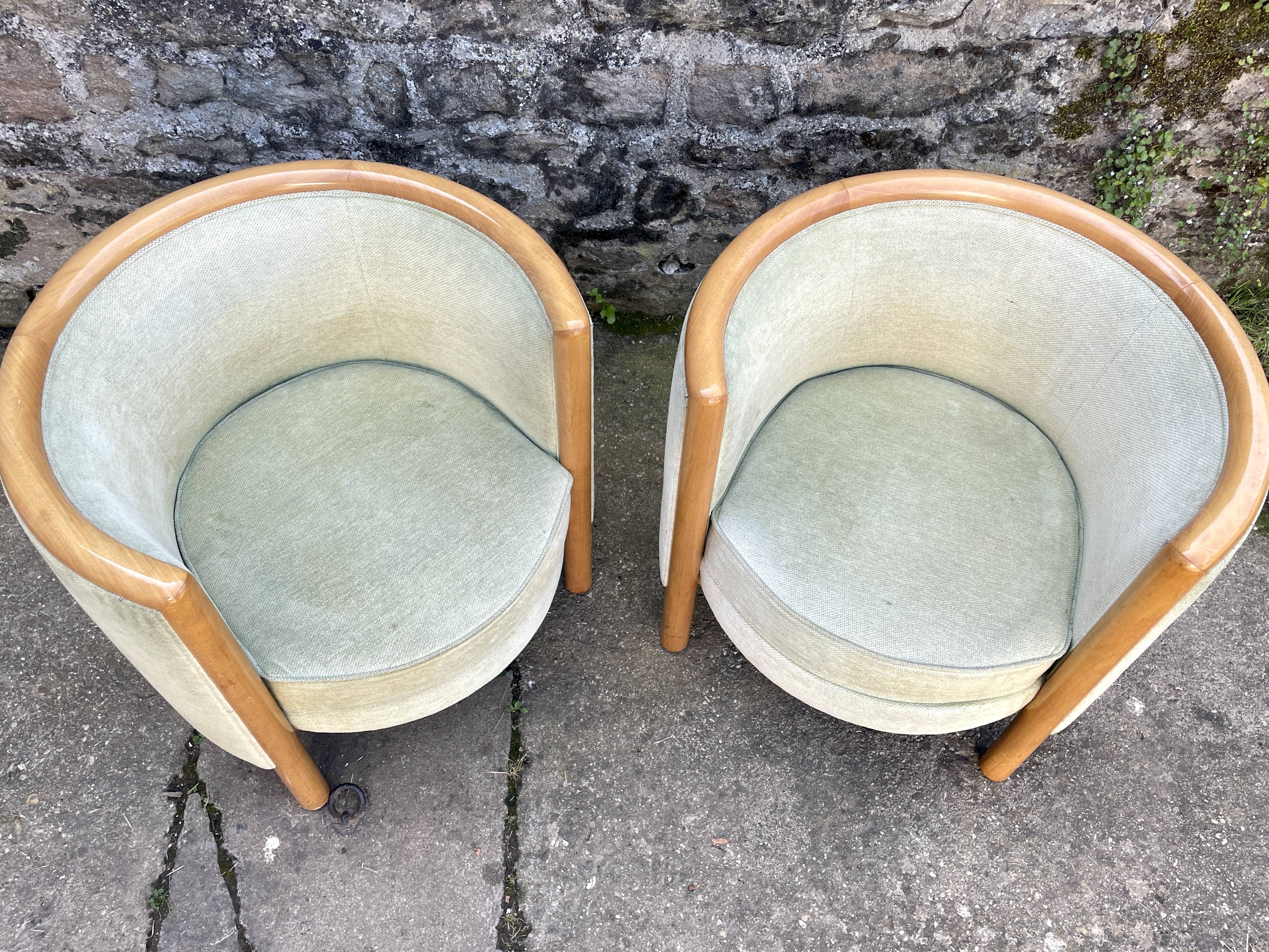 Pair of barrel-shaped armchairs in beech and almond green velvet by Maison Rosello