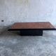 Vintage coffee table in wood burl on a black lacquered base.