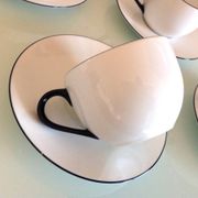 Set of eight white porcelain cups with blue edging / vintage 70s-80s